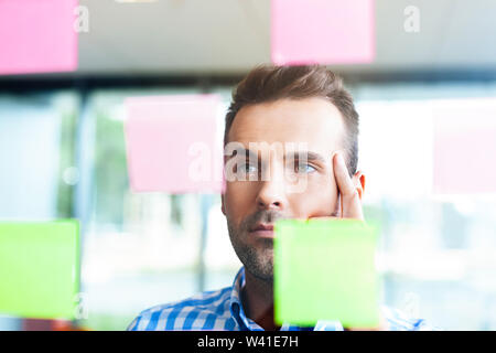 thoughtful man working in the office Stock Photo