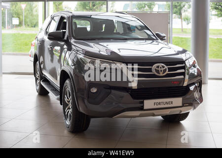 Russia, Izhevsk - July 18, 2019: New cars in the Toyota showroom. Modern Fortuner. Famous world brand. Prestigious vehicles. Stock Photo