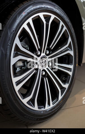 Russia, Izhevsk - July 18, 2019: Showroom Toyota. The wheel with alloy wheel of a new Corolla. Famous world brand. Prestigious vehicles. Stock Photo