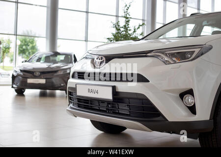 Russia, Izhevsk - July 18, 2019: New cars in the Toyota showroom. Modern RAV4. Famous world brand. Prestigious vehicles. Stock Photo