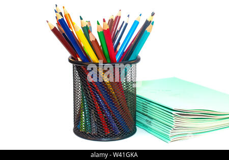Color pencils and notebooks for school isolated on white Stock Photo