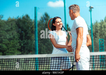 Dark-eyed wife spending sport weekend with husband Stock Photo