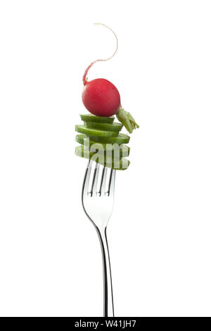 Fresh, sliced cucumber and crispy radish on fork isolated on white background Stock Photo