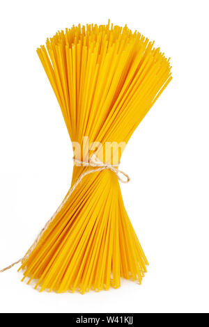Spaghetti tied with rope, close-up on a white background. Isolate. Stock Photo