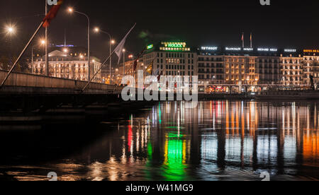 Geneva, Switzerland - November 24, 2016: Street view of Geneva city at night. Pont du Mont-Blanc Stock Photo