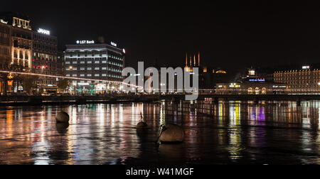 Geneva, Switzerland - November 24, 2016: Panoramic cityscape with illuminated facades of Geneva city central district at night Stock Photo