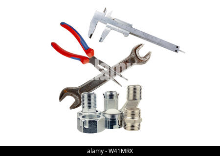 Metal adapters for water supply with the tool on a white background Stock Photo