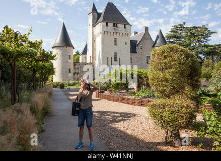 Lady photographing in the Chateau du Rivau, Loire Valley, France Stock Photo