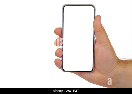 Female hand holding black cellphone with white screen at isolated background. Stock Photo