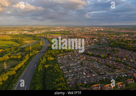 Aerial view above the A19 motorway overlooking the housing estates and countrysid of Stockton-on-Tees in Teeside during sunset on a quiet summers day Stock Photo