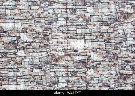 A gray bricks wall background vintage and modern texture Stock Photo