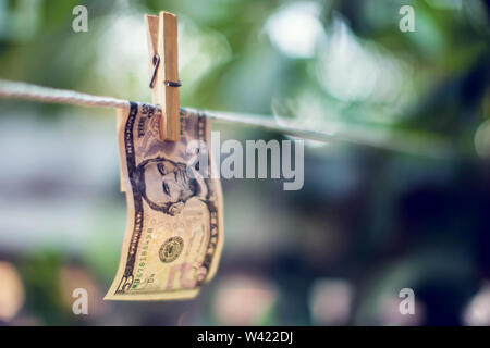 US dollar banknotes hanging on rope for money laundering conept Stock Photo