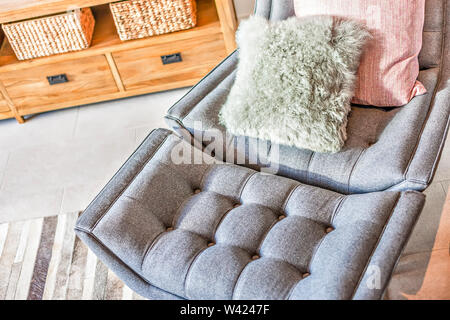Closeup of a cushion or leather sofa with wool pillows on it, these benches are very comfortable with the embossed design on the surface Stock Photo