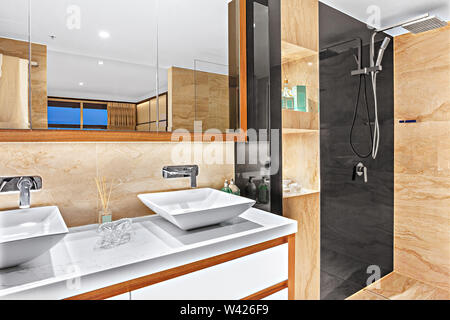 Neatly organized vanity top with designer basins and essential products Stock Photo