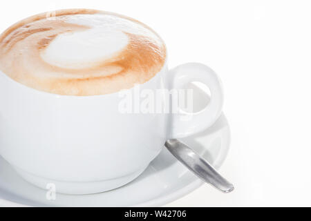 Milk cup with white table and spoon, colorized photograph including perfect lights, very tasty hot drink of luxury house. Stock Photo