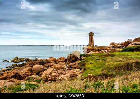 Ploumanach Mean Ruz lighthouse in pink granite coast, Perros Guirec, Cotes d'Armor, France Stock Photo