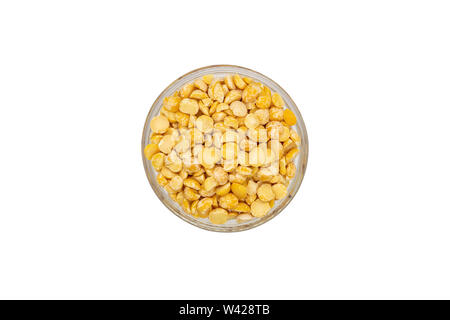 Yellow split dried peas in bowl, isolated, close up, macro, top view. Healthiest nutritious food. Stock Photo