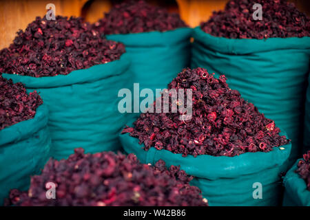 Dry herb hibiscus for tea in baskets. Arabic herbs on traditional bazaar. Natural organic food. Stock Photo