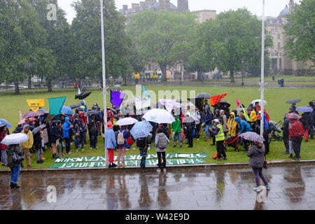 Bristol, UK. 19th July 2019. Rain pours on the Extinction Rebellion ...