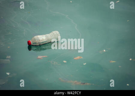 Plastic trash in sea or ocean. Plastic bottles, bags, straws and cups underwater. Environmental pollution problem. Stock Photo