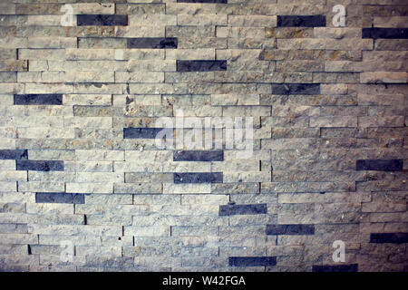 Closeup surface brick pattern at old stone brick wall textured background Stock Photo