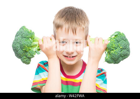 boy with broccoli, studio portrait on white background isolated Stock Photo