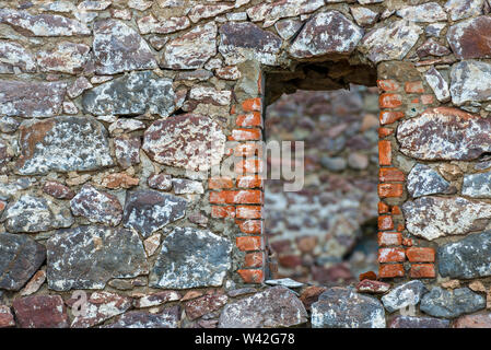 Ancient castle wall with niche window close up Stock Photo
