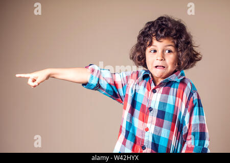 Little boy shows on something. Children, emotions concept Stock Photo