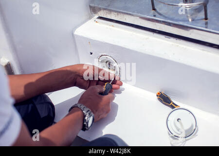 A man worker fix socket in the wall. Stock Photo