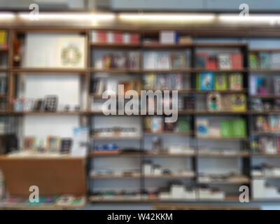 abstract blurred of books on bookshelf in library, abstract blur defocused effect. library and knowledge for background concept Stock Photo