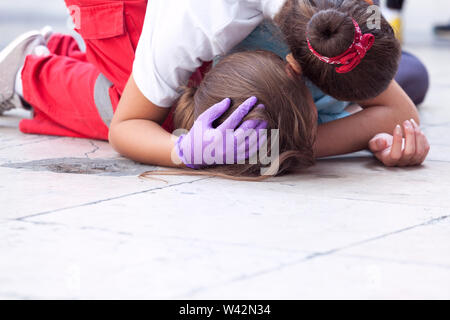 Emergency first aid for heatstroke victim Stock Photo