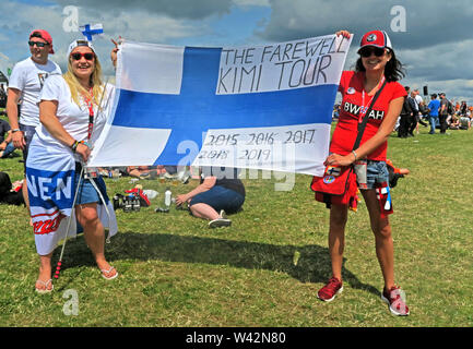 Formula One Fans,with flag,The Farewell Kimi Tour, flag, 2015,2016,2017,2018,2019, Silverstone Circuit, Towcester,Northamptonshire, UK Stock Photo