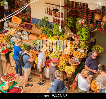 People buying fruit and vegetables from an outdoor market in Funchal Madeira Europe. Stock Photo