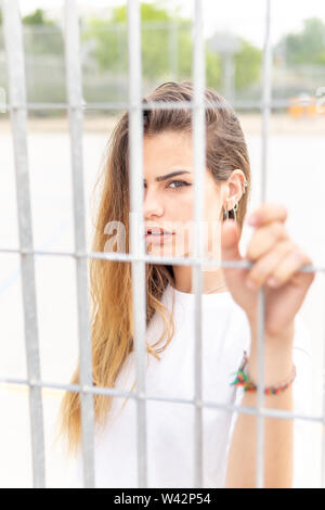 Beautiful smiling girl wearing casual summer clothes enjoys sunny day. Beauty, fashion shot. Stock Photo