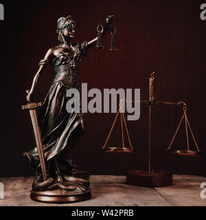 Law offices of lawyers legal statue Greek blind goddess Themis bronze metal statuette figurine with scales of justice. - Image Stock Photo