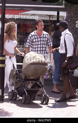 25.06.2002 JORDAN Katie Price AND FOOTBALL PLAYER DWIGHT YORKE TAKE THEIR NEWBORN BABY HARVEY FOR A STROLL AROUND BRIGHTON S FAMOUS LANES SHOPPING DISTRICT Stock Photo Alamy