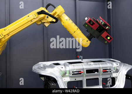 Combined 3D scanner and robotic arm automate scanning. Optical 3D coordinate measuring machine. Stock Photo