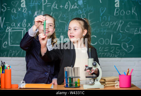 School experiment. Science concept. Private school. Gymnasium students with in depth study of natural sciences. Knowledge crossroads molecular biology and chemistry. School project investigation. Stock Photo