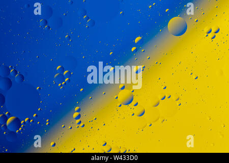 Oil on water flat colorful duotone macro abstract background photographic image. Stock Photo