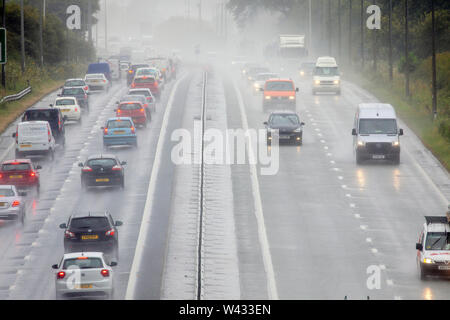 Flintshire, North Wales, UK 19th July 2019. UK Weather:  Heavy rainfall as motorists head into Wales along the A55 for the summer getaway holidays on what is the most busiest days on the roads, A55, Halkyn, Flintshire, Wales © DGDImages/AlamyLiveNews Stock Photo