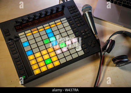 Home music production. An Ableton Push midi pad controller with Macbook, microphone and headphones Stock Photo