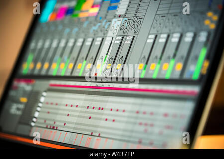 Electronic music production in a home studio. Closeup of Ableton Live software on an Apple Macbook laptop Stock Photo