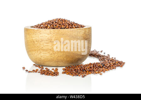 Lot of whole raw red quinoa seeds in a wooden bowl isolated on white background Stock Photo