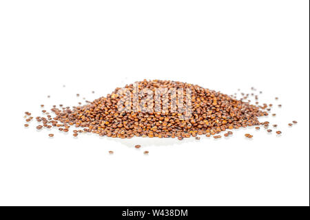 Lot of whole raw red quinoa seeds heap isolated on white background Stock Photo