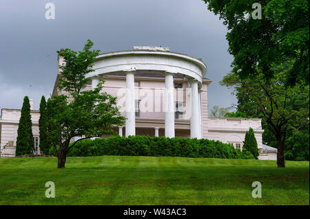 Saltville,Virginia,USA - May 11, 2019:  The front of a beautiful mansion and it manicured lawn seen from a country road in rural Virginia in the Appal Stock Photo
