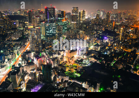 Aerial view of Tokyo at night. Tokyo mixes the ultramodern and the traditional, from neon-lit skyscrapers to historic temples. Stock Photo