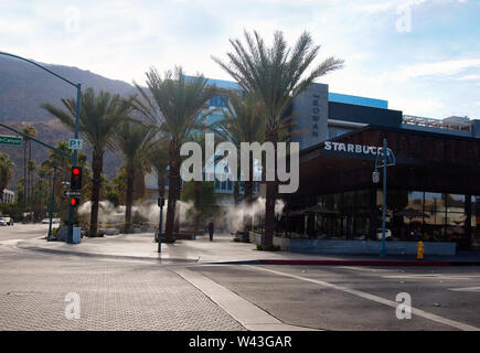 PALM SPRINGS, CA - JULY 18, 2018: On an extremely hot day in the desert town of Palm Springs, California, a Starbucks has established an outdoor misti Stock Photo