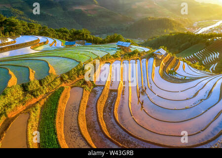 Rice and Water on terraces Mu Cang Chai, Yen Bai, Vietnam same world heritage Ifugao rice terraces in Batad, northern Luzon, Philippines. Aerial view Stock Photo