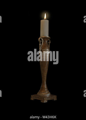 Burning Wax Candle Isolated on Black Background. Stock Photo