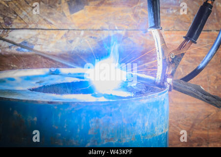 Spark light with welding Process with blue tube metal and bright sparks in steel Stock Photo